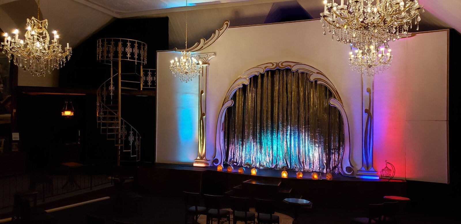 The golden staircase inside Intrigue Theater's 125-year-old Gothic building — Eureka Springs, Arkansas